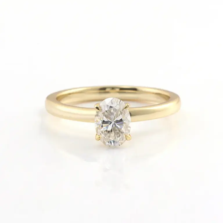 10k gold oval cut moissanite four prong solitaire engagement ring 1
