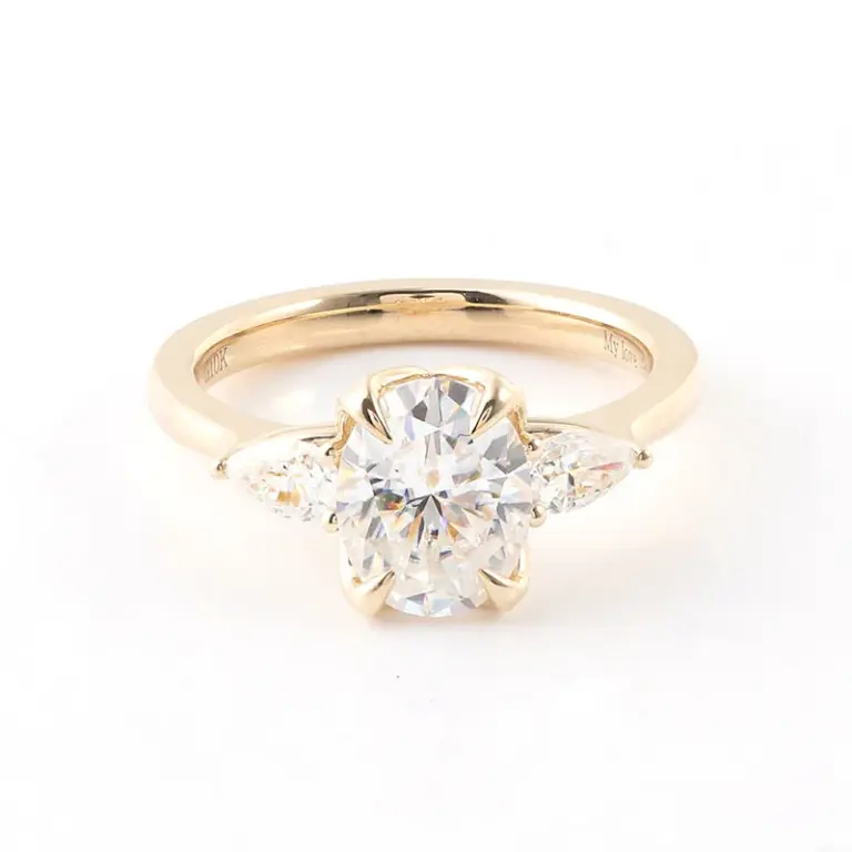 10k gold oval moissanite prong set three stone engagement ring 1