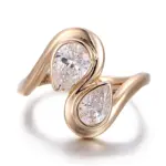 10k gold pear shape moissanite bezel toi et moi engagement ring 1