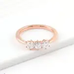 10k rose gold hexagon moissanite prong set three stone engagement ring 1