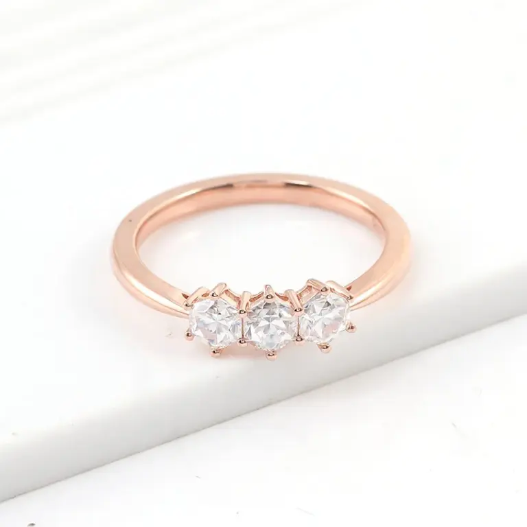10k rose gold hexagon moissanite prong set three stone engagement ring 1