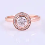 10k rose gold round cut moissanite bezel halo engagement ring 1