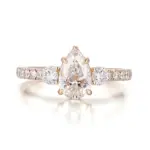 14k gold pear lab grown diamond prong set side stone engagement ring 1