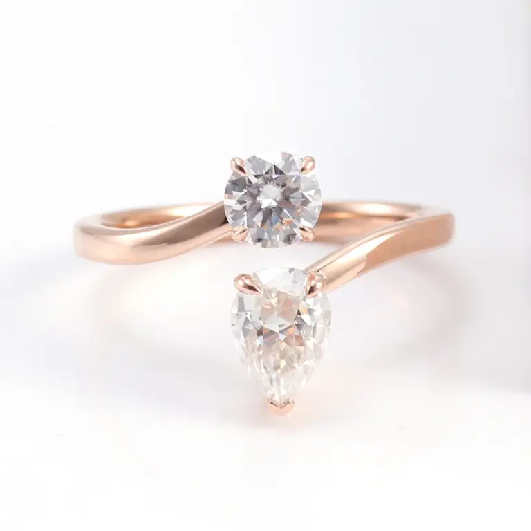 14k rose gold round pear moissanite prong set toi et moi engagement ring 1