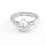 14k white gold oval moissanite prong set three stone engagement ring 1