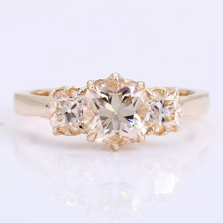 18k gold cushion moissanite prong set three stone engagement ring 1