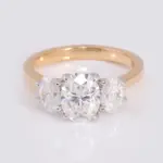 18k gold oval moissanite prong set three stone engagement ring 1