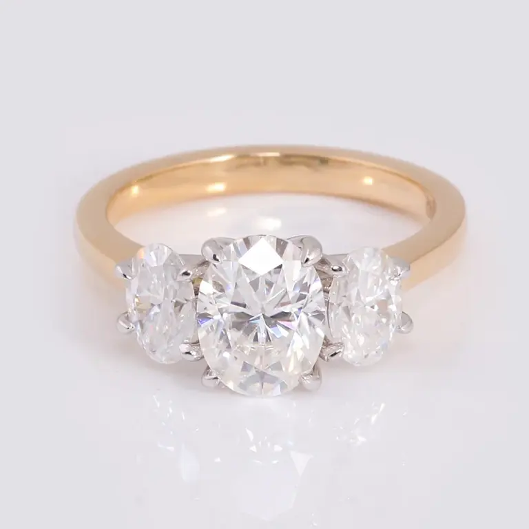 18k gold oval moissanite prong set three stone engagement ring 1