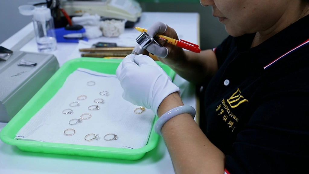 a provence jewelry quality inspector is checking the quality of the jewelry