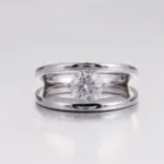 platinum round cut moissanite channel split shank engagement ring 1