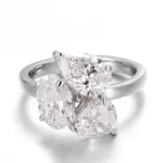 18k white gold pear lab grown diamond prong set three stone engagement ring 1