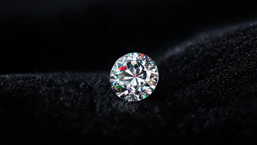 Loose round moissanite gemstone displaying fire light dispersion