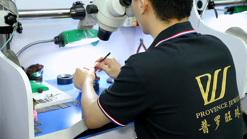 a stone setting worker is doning his job in workshop