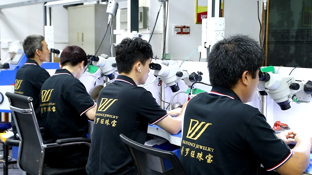 crafters of jewelry manufacturers for small business doing stone setting in workshop