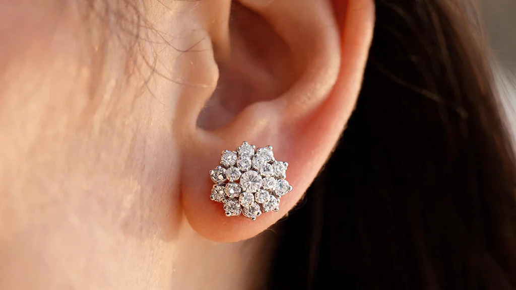 Diamond cluster stud earring close up