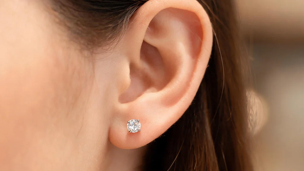 Diamond stud earring worn on the earlobe
