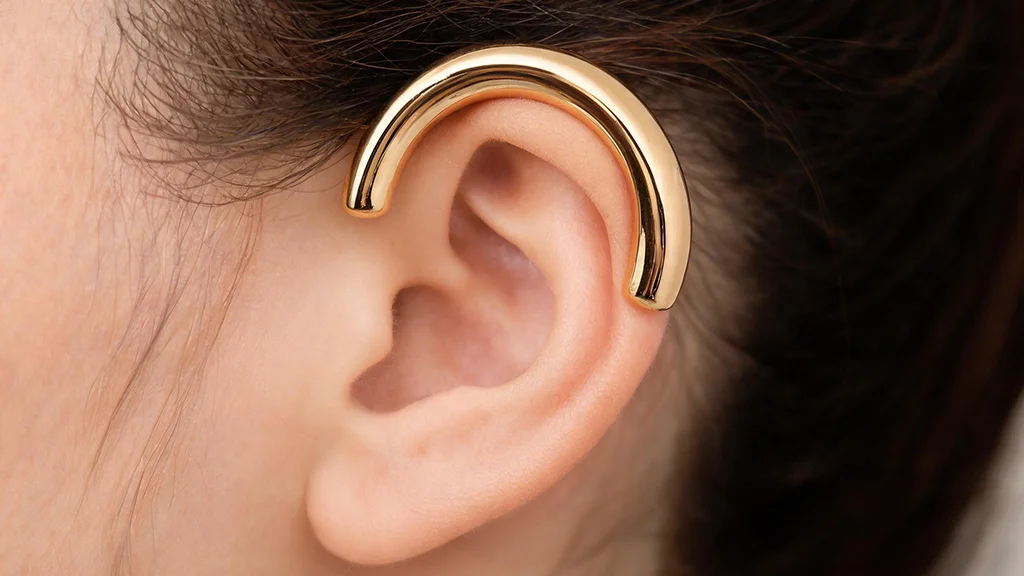 Gold ear cuff on cartilage without piercing