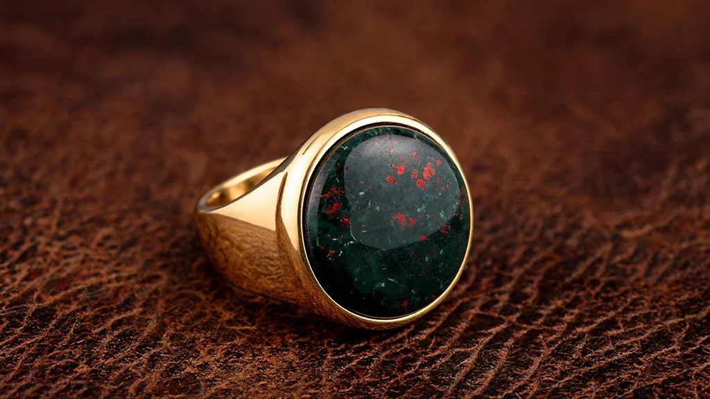 Men's gold signet ring featuring a bloodstone cabochon