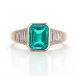 14k gold 3ct emerald green lab grown emerald side stone engagement ring 1