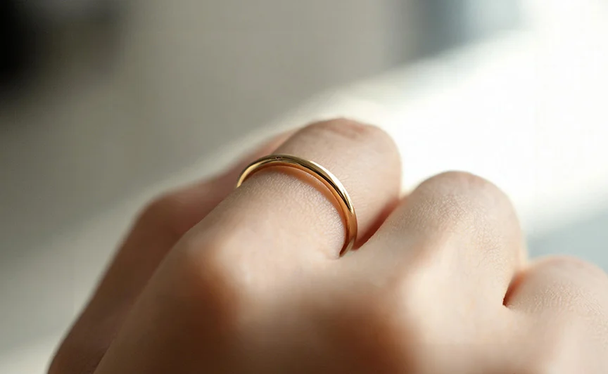 Close up of a ring worn against skin, illustrating metal to skin contact